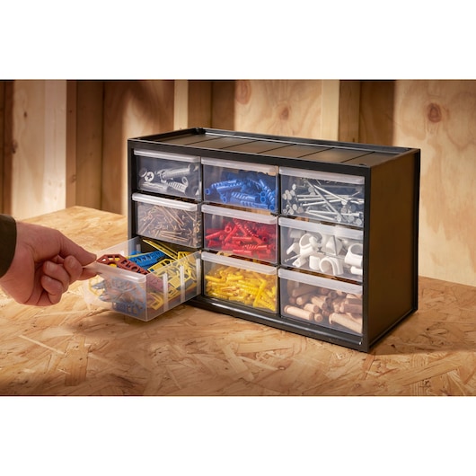 STANLEY 1-93-978 drawer organizer with assorted fasteners, viewed from the front on a workbench.