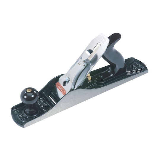 STANLEY hand planer, side angle, black metal body with chrome blade and black handles on white background
