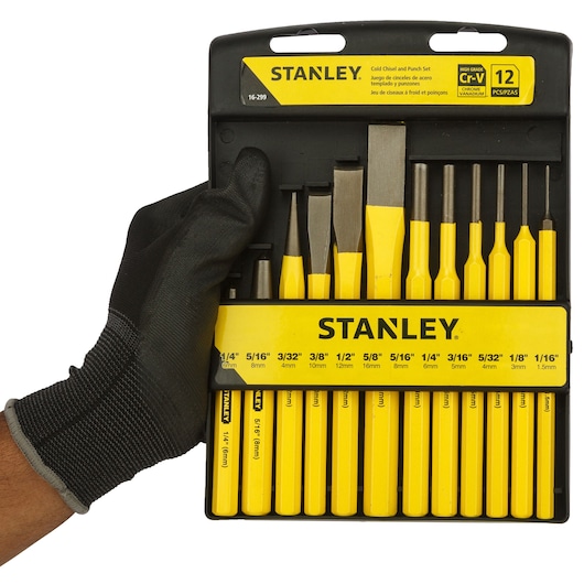 12 piece punch and chisel kit in the hand of a person.