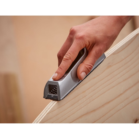 Photo of STANLEY 5-21-399 hand planer smoothing wood edge, close-up view.