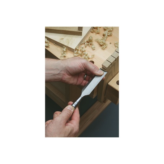 8 piece sweetheart 750 series socket chisel set being used to chisel a piece of wood.