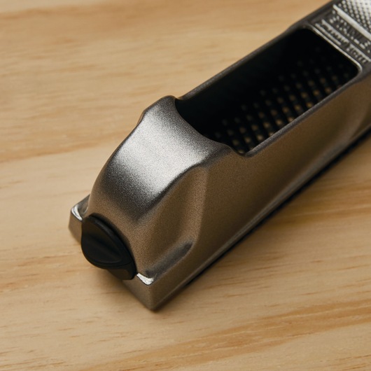 Thumb screw blade tension feature in 6 inch surform pocket plane.