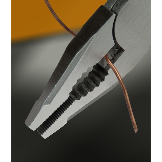 STANLEY FMHT0-72414 pliers gripping copper wire, close-up photography.
