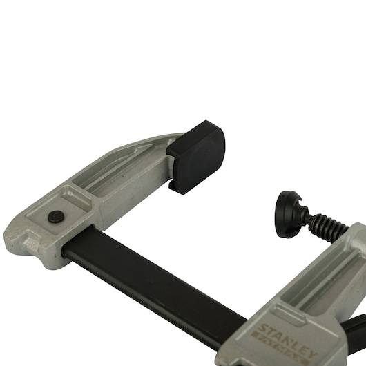 STANLEY FMHT0-83244 photography of gray heavy-duty metal clamp with black screw handle, side angle.