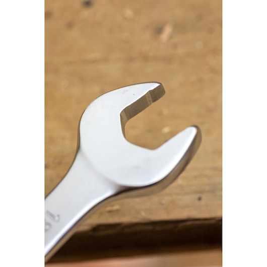STANLEY FMMT13084-0 open-end wrench closeup on wood background, silver finish, hand tool.