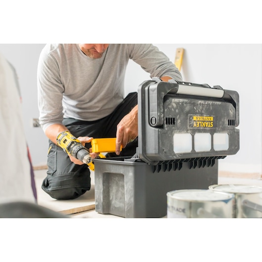 Photo of STANLEY FATMAX FMST1-75792 toolbox in use, open on the floor with tools inside.