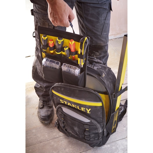 STANLEY STST83307-1 black and yellow tool backpack open, showing organized tools and boxes, front angle.